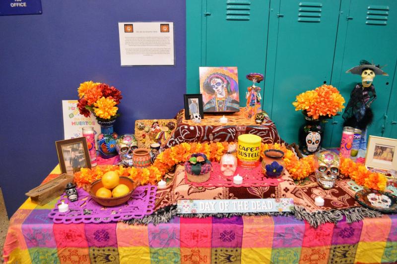 table with a vibrant tablecloth and festive decorations