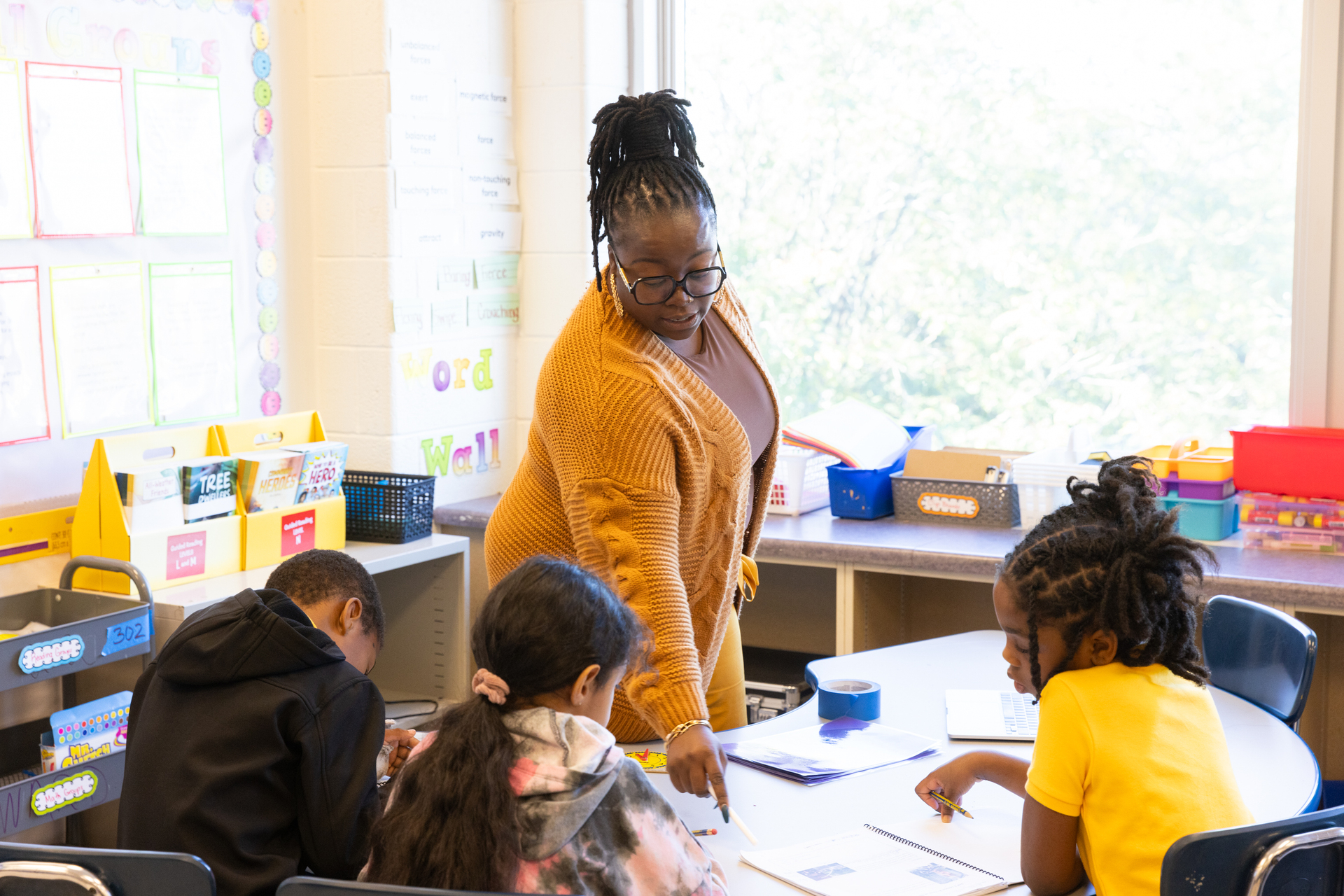 Teacher working with students