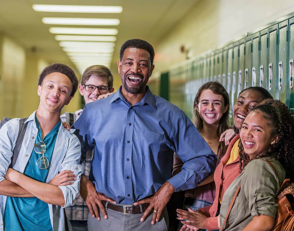 teacher surrounded by students