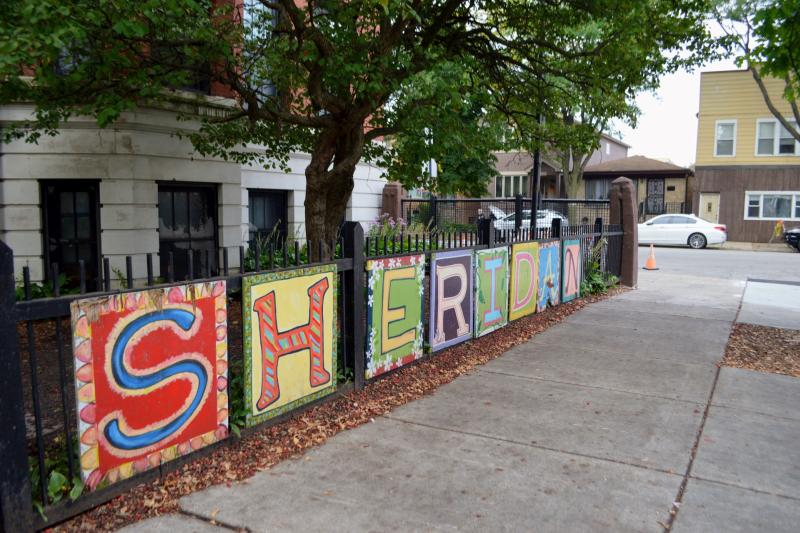 a sign on a fence