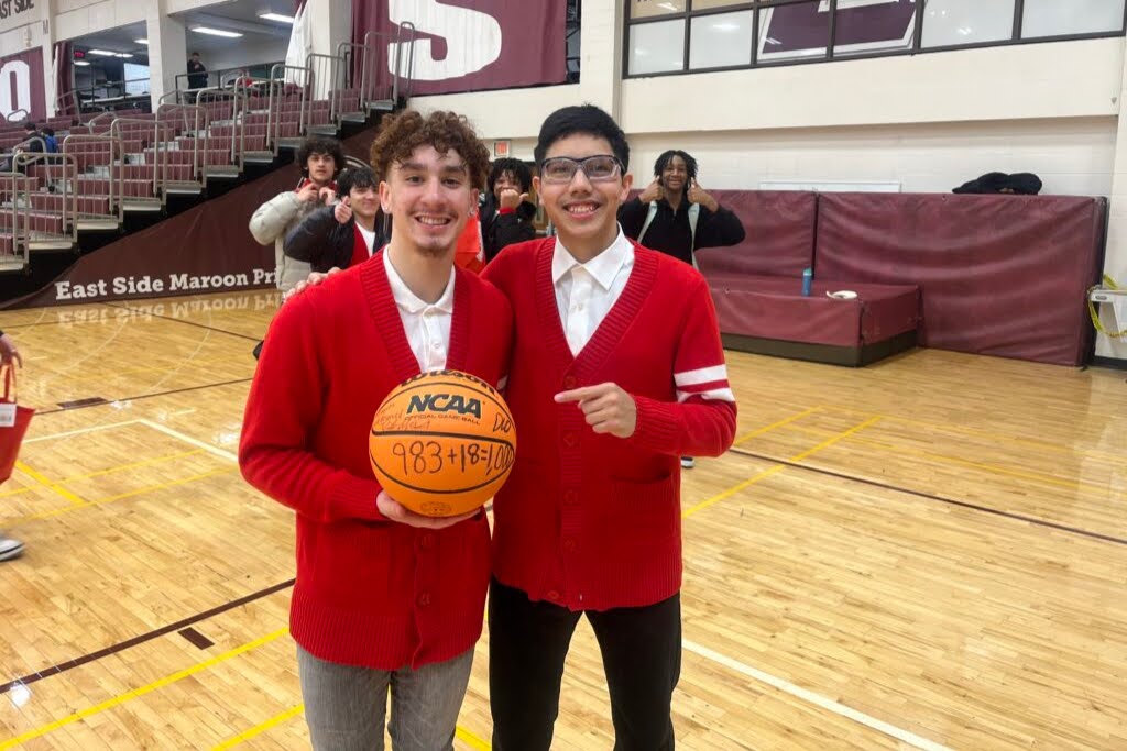 image of two students on a basketball court