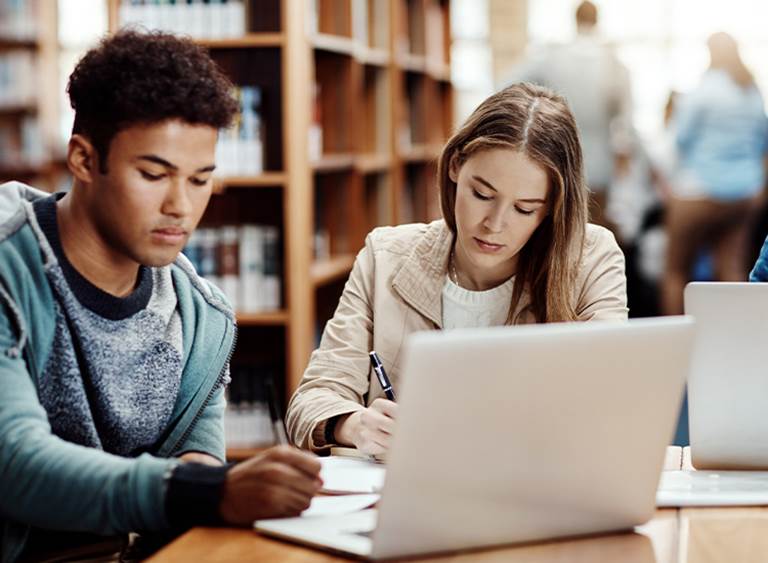 Students work at a computer