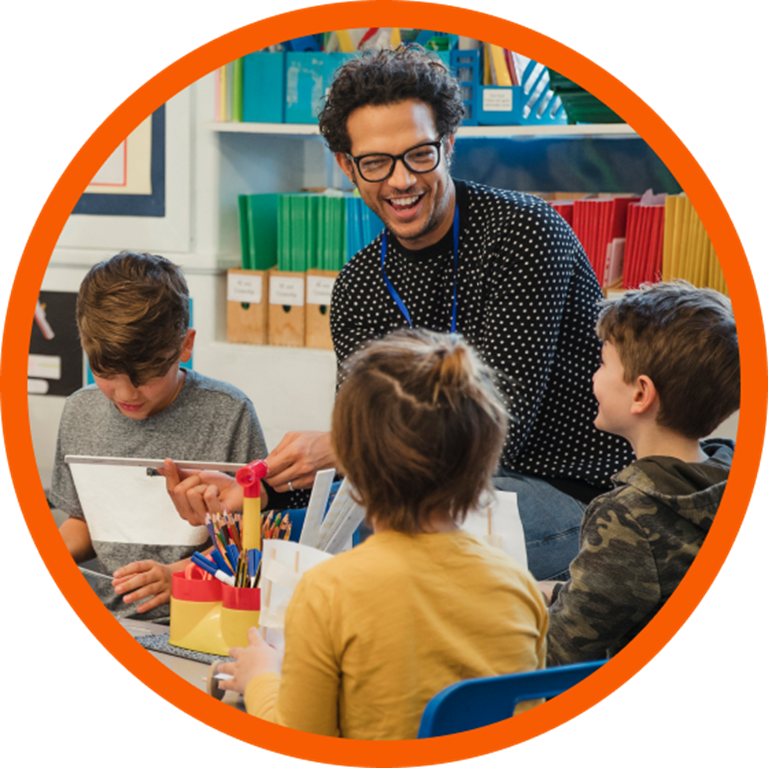 Teacher teaching a group of young students