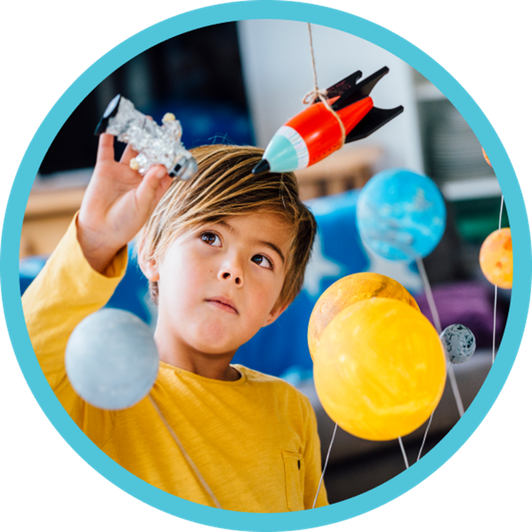 Kid playing with science toys