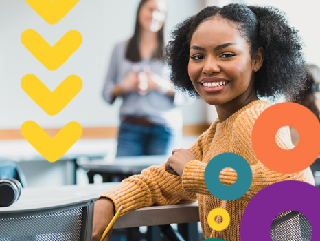 Student smiling in a classroom