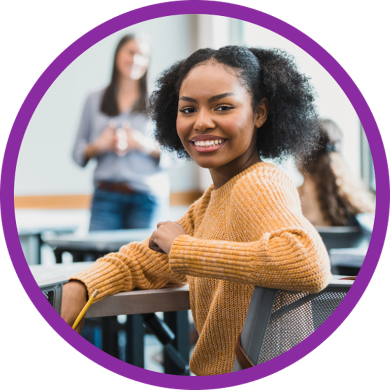 Smiling student in a classroom