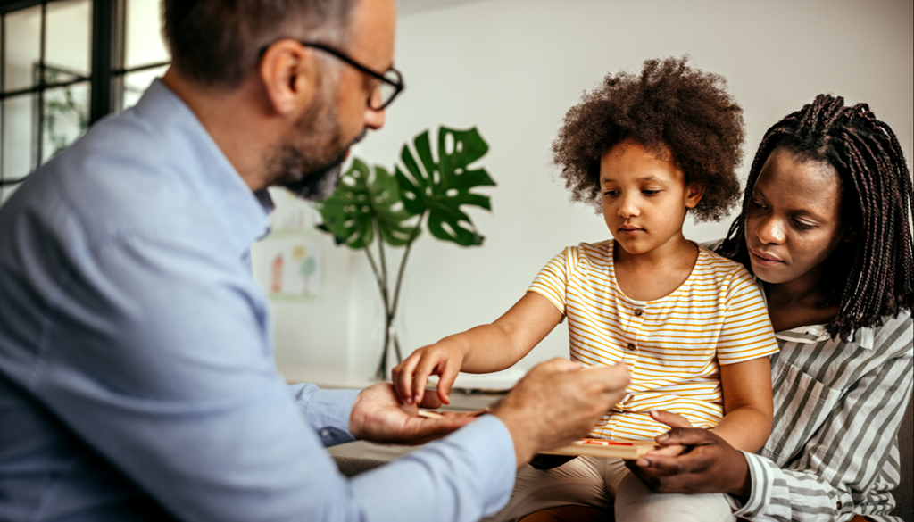 Adults working with a child