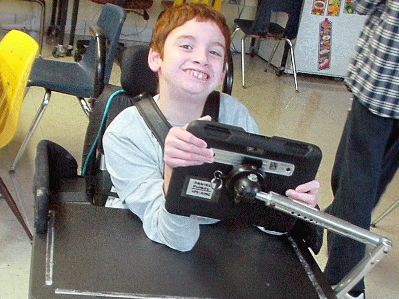 Student using an Augmentative/Alternative Communication (AAC) device.