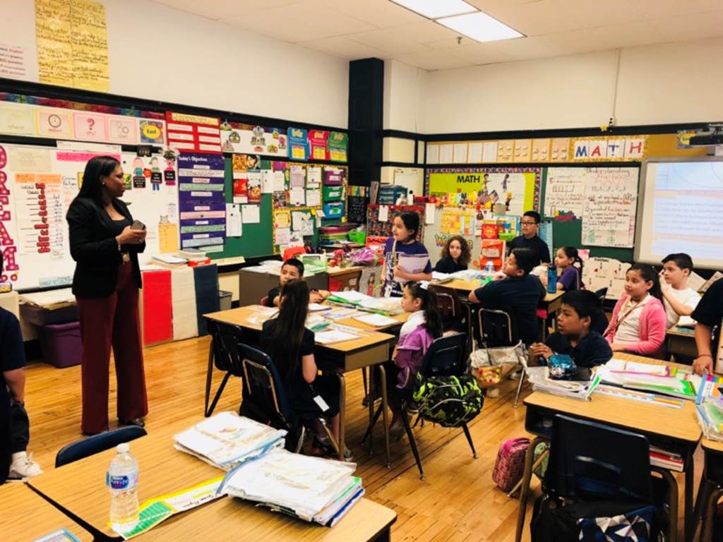 Janice Jackson stand in the front of a classroom