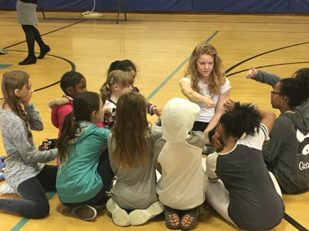 Children sit in a circle