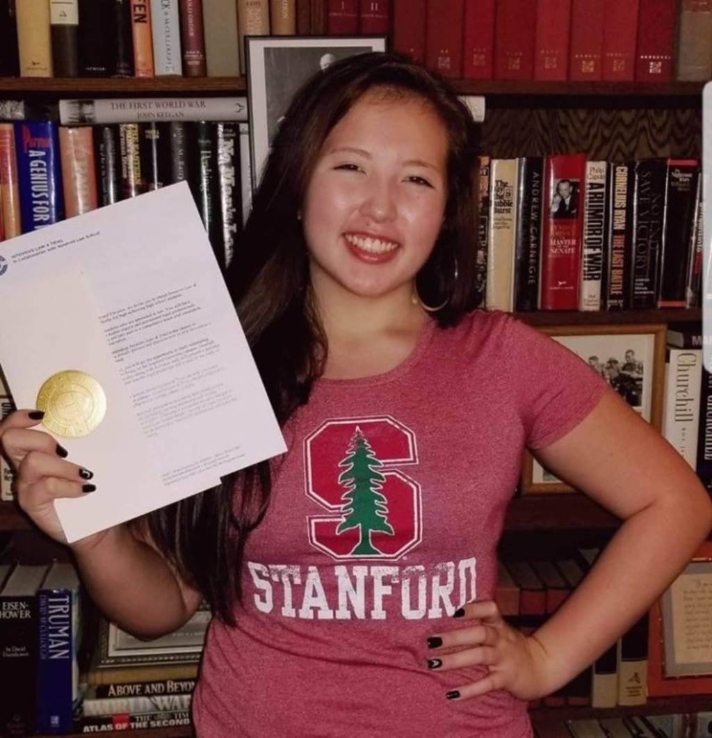 Student holding her acceptance letter