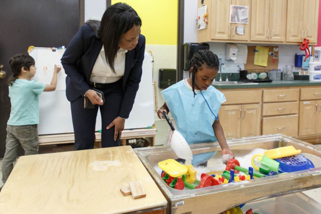 Janice Jackson interacts with a playing student