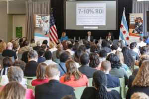 Janice Jackson and Mayor Emanuel present to an audience of people 