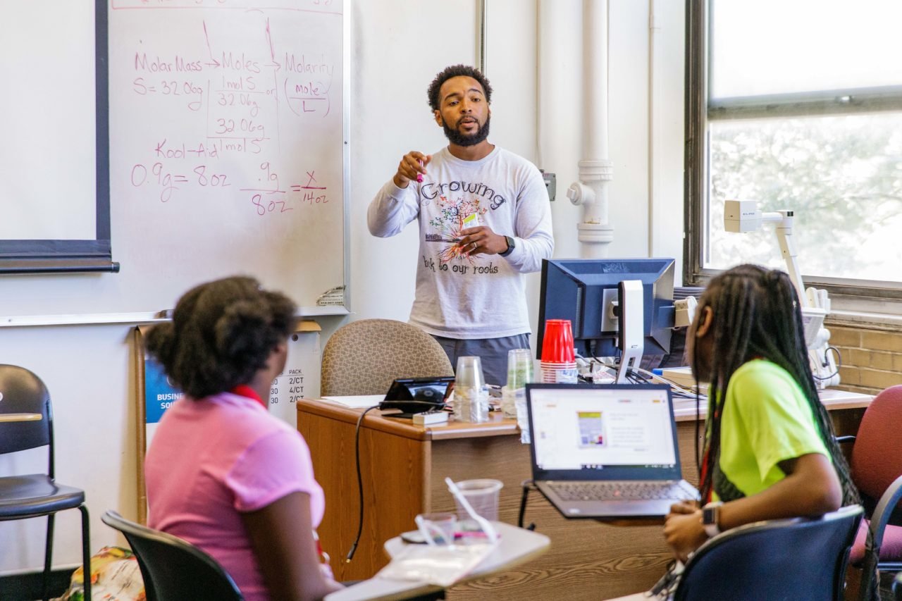 Teacher lecturing to students in class