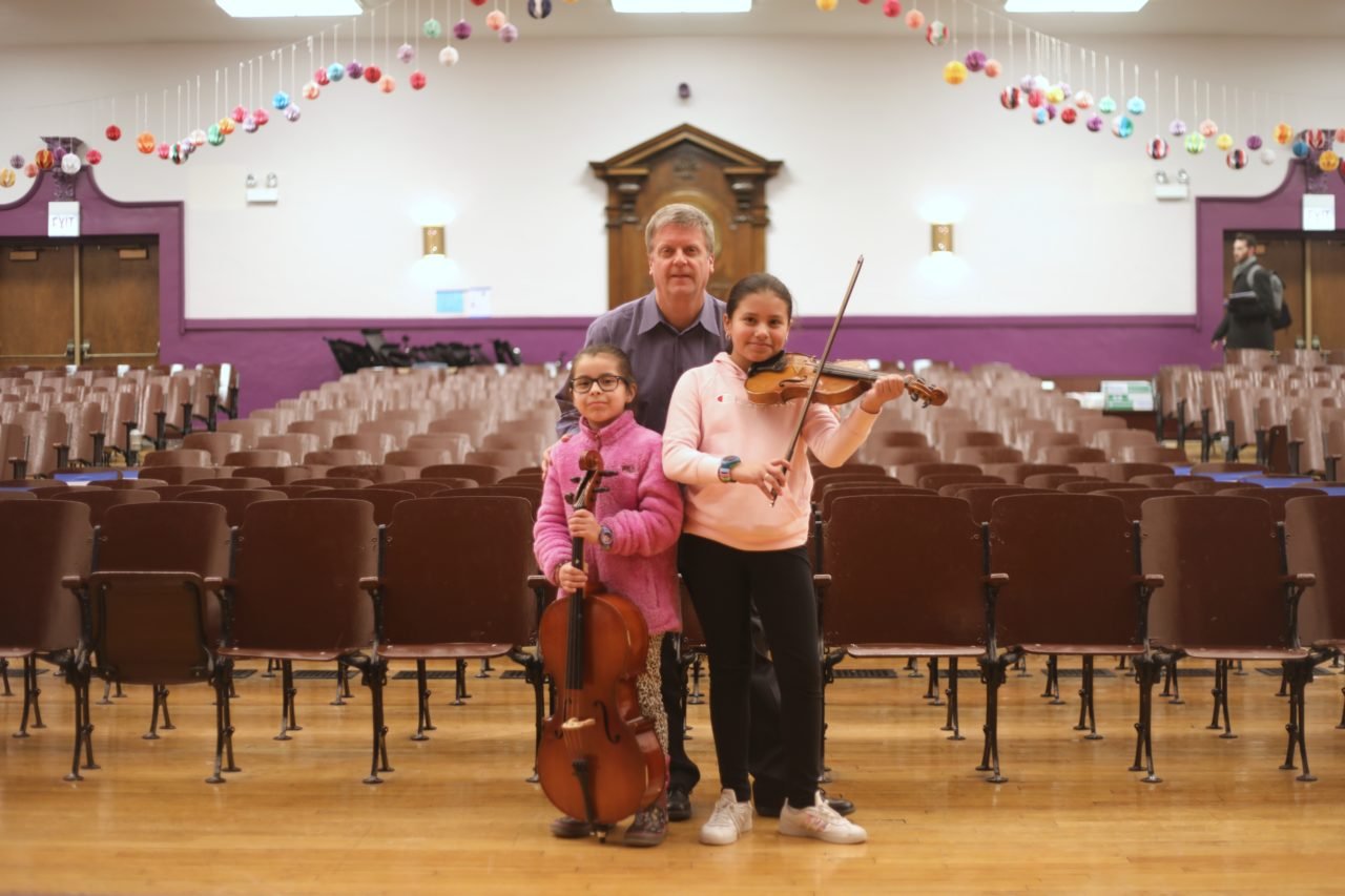 Left to Right: Hibbard Elementary Student Isabella B., Principal Scott Ahlman, and Student Melissa R.