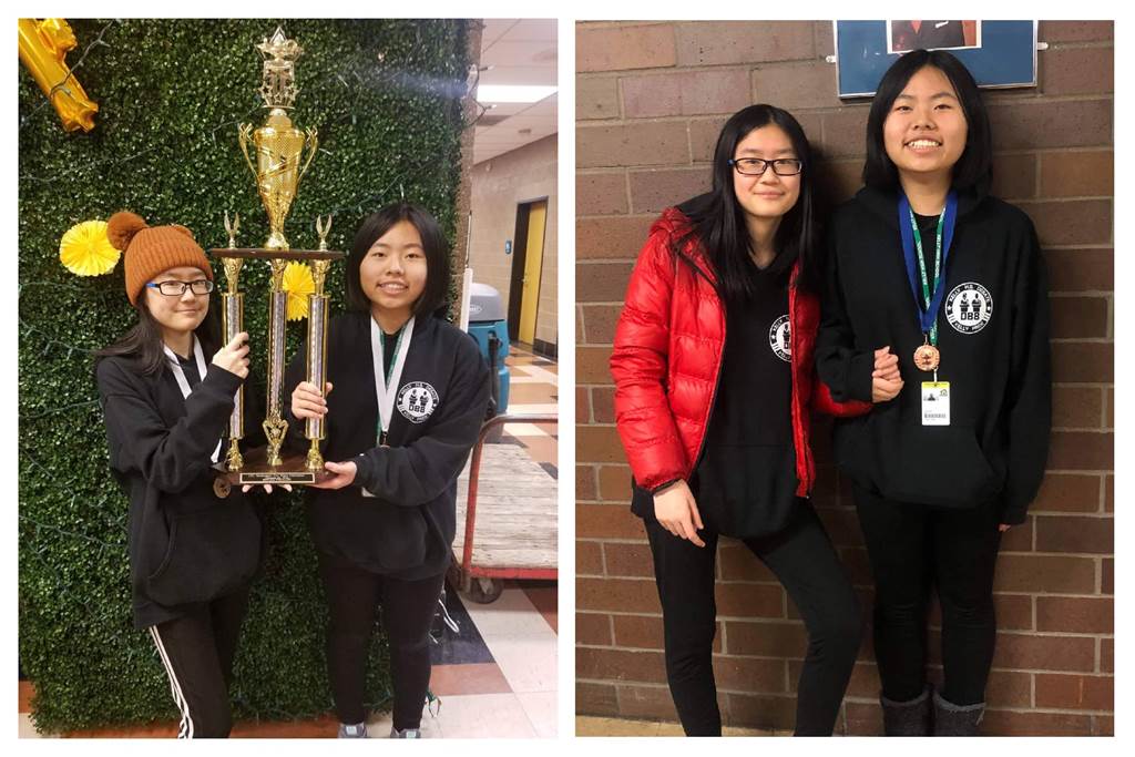 Two girls holding a trophy