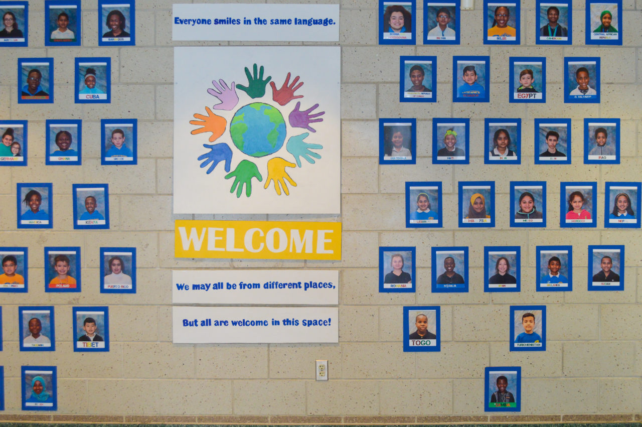 A wall with student photos