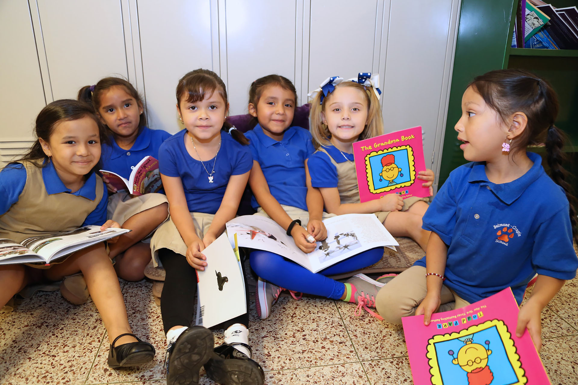 Students posing with books