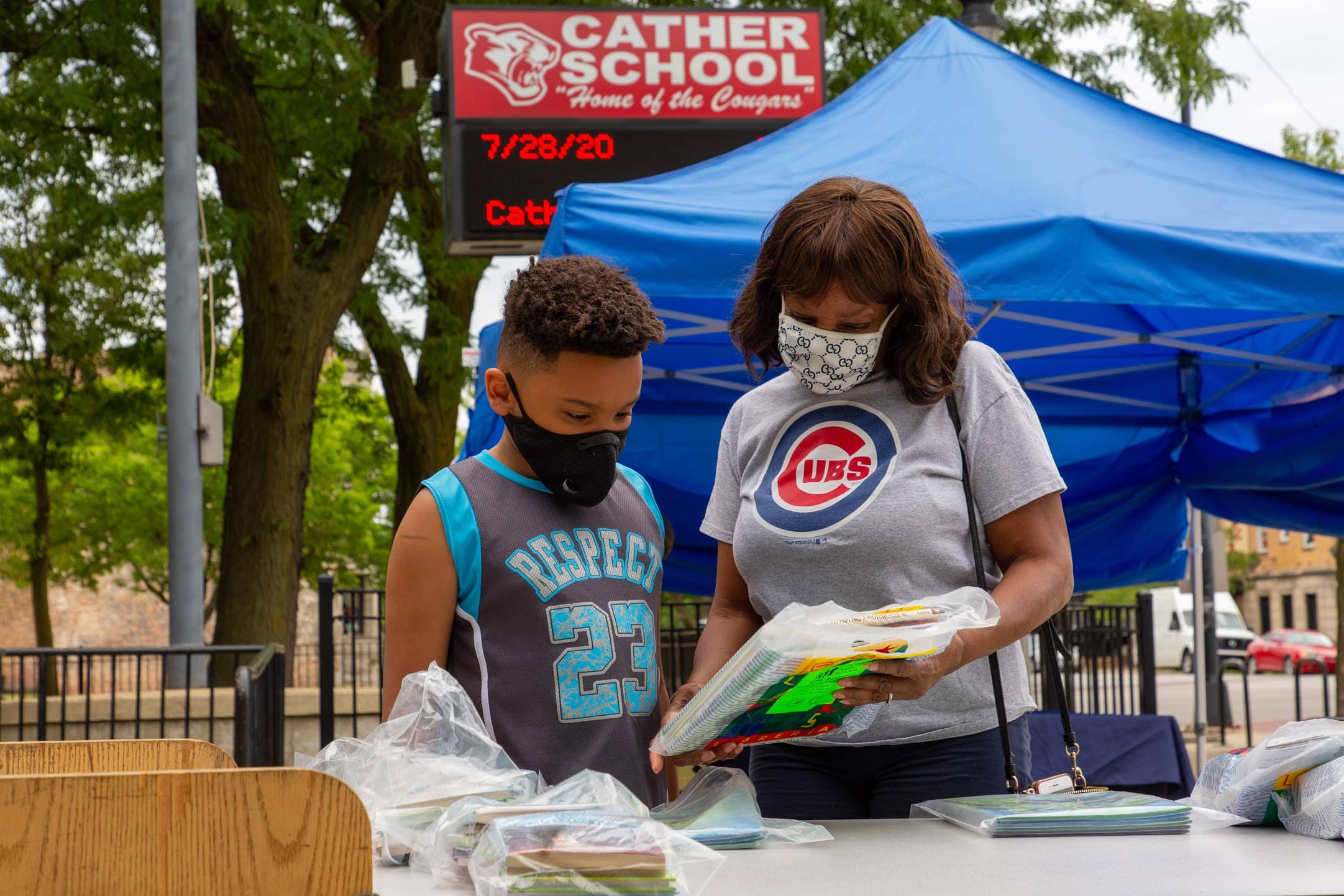 A parent and child looking a book