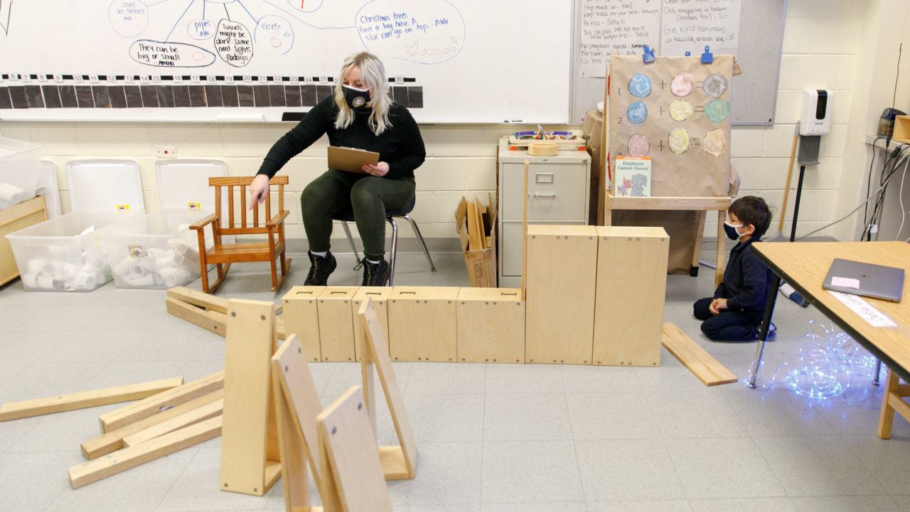 Students stacking boxes