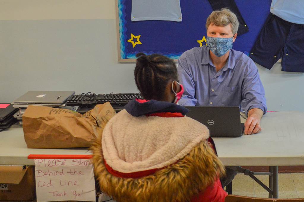 Mr. Gunn talking to a student