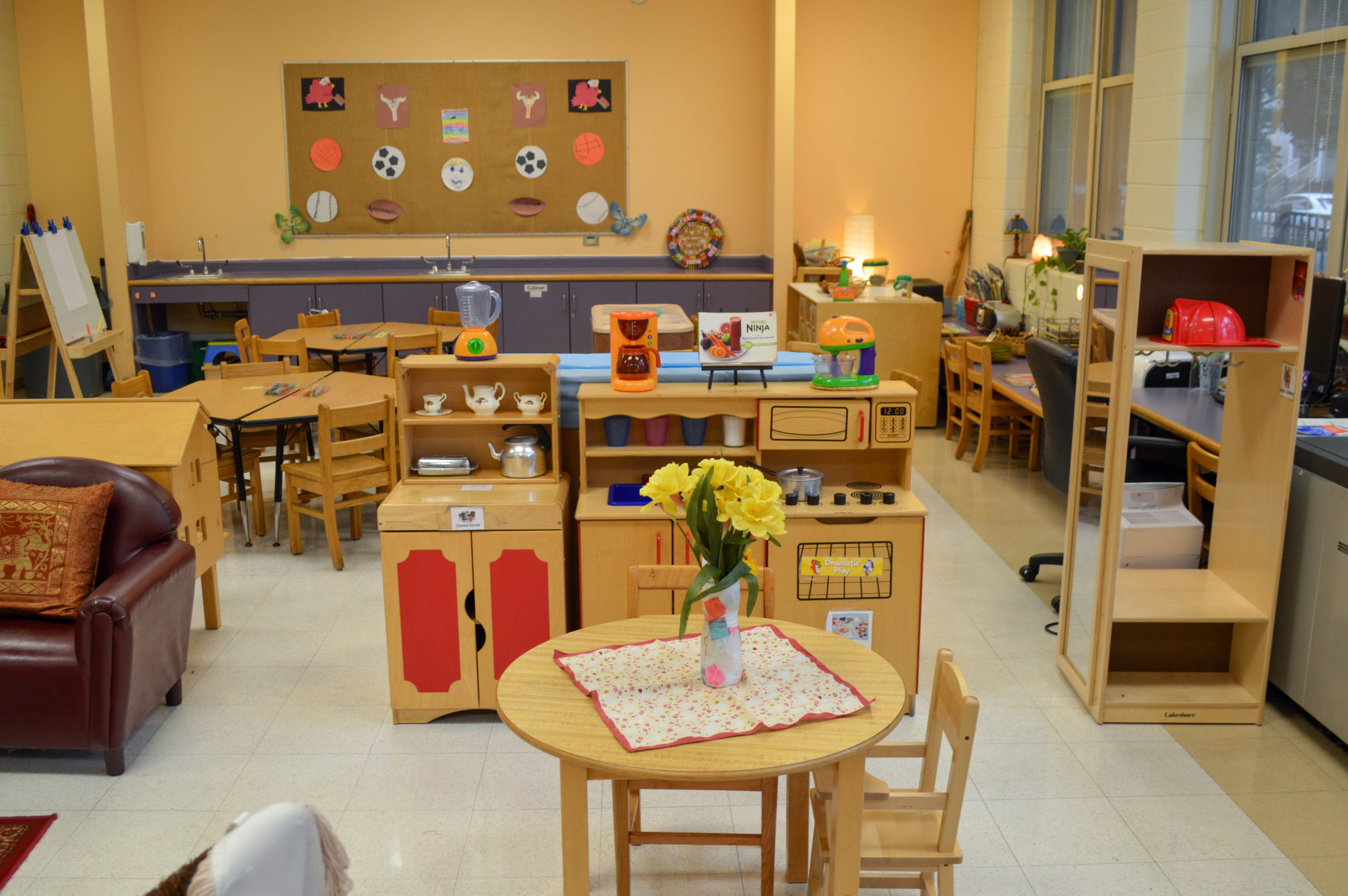 A classroom with tables and chairs