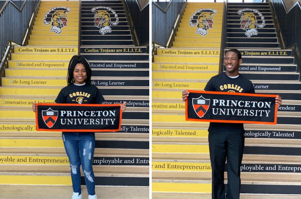 Nakiela and Ahmad holding Princeton university banners