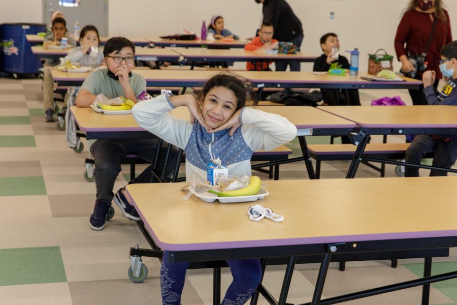 A student posing with her head between her hands