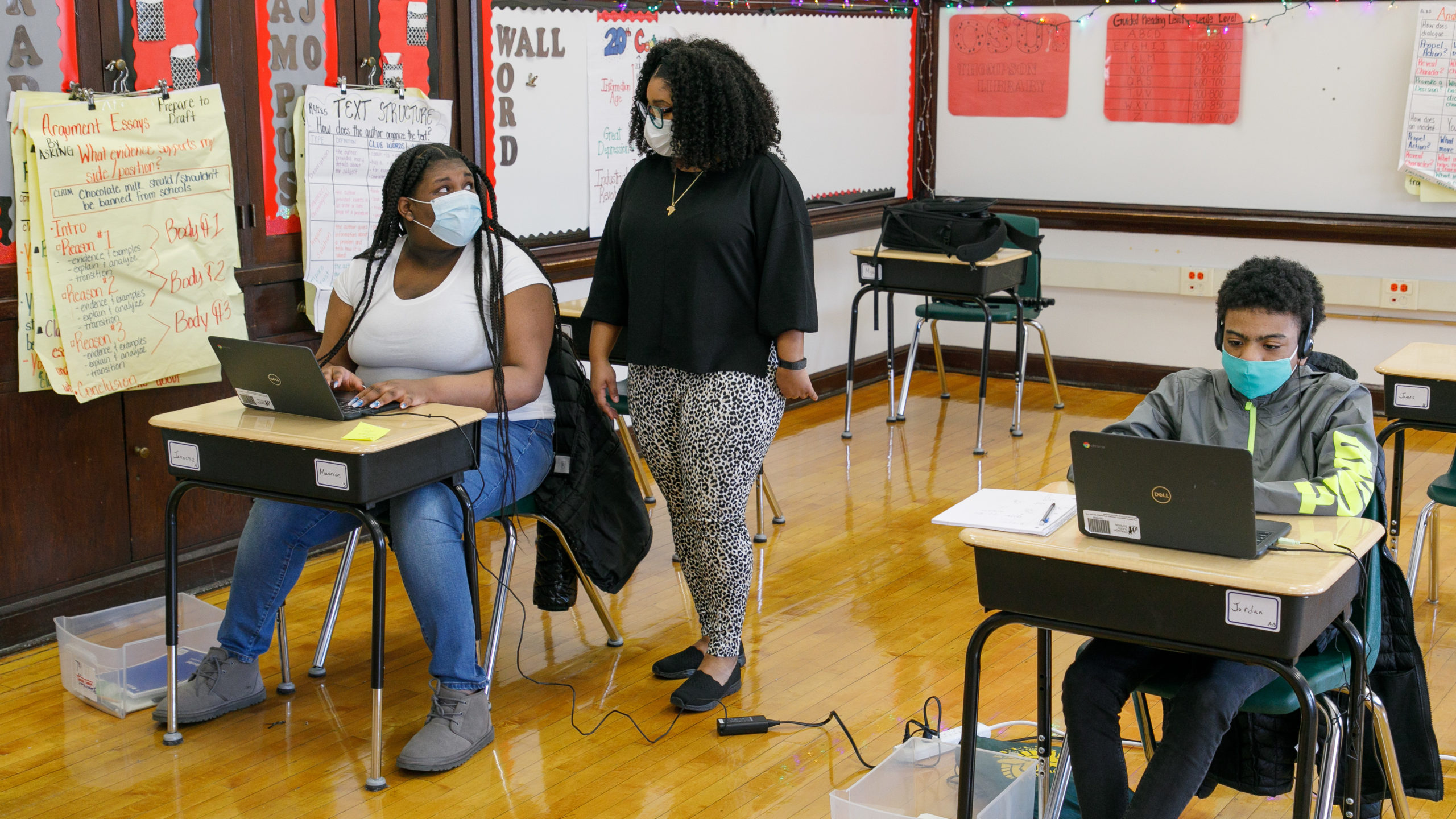 A teacher talking to her student