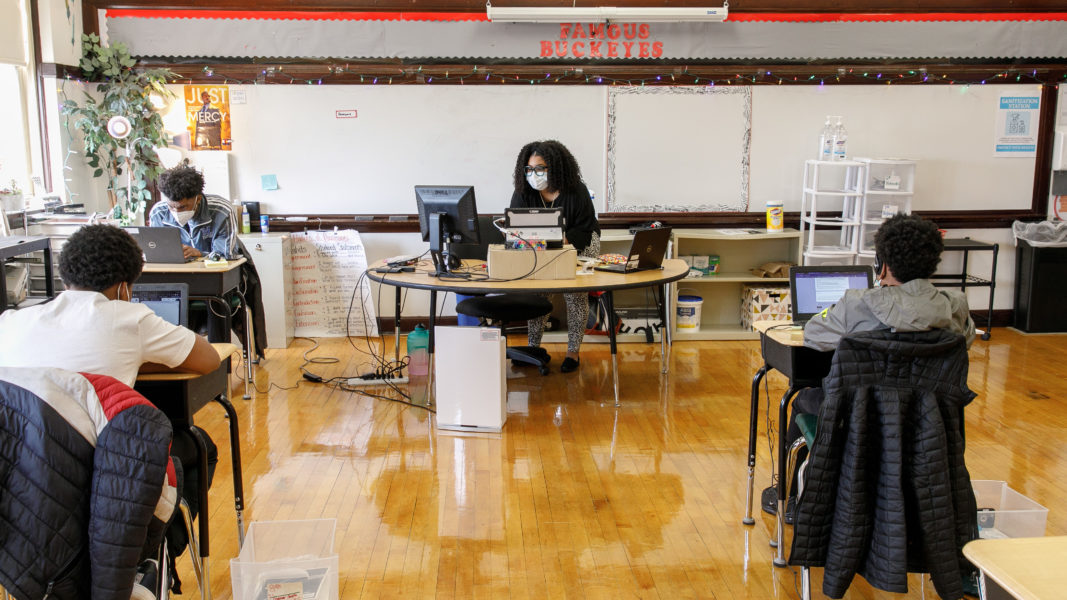 A teacher sitting at her desk