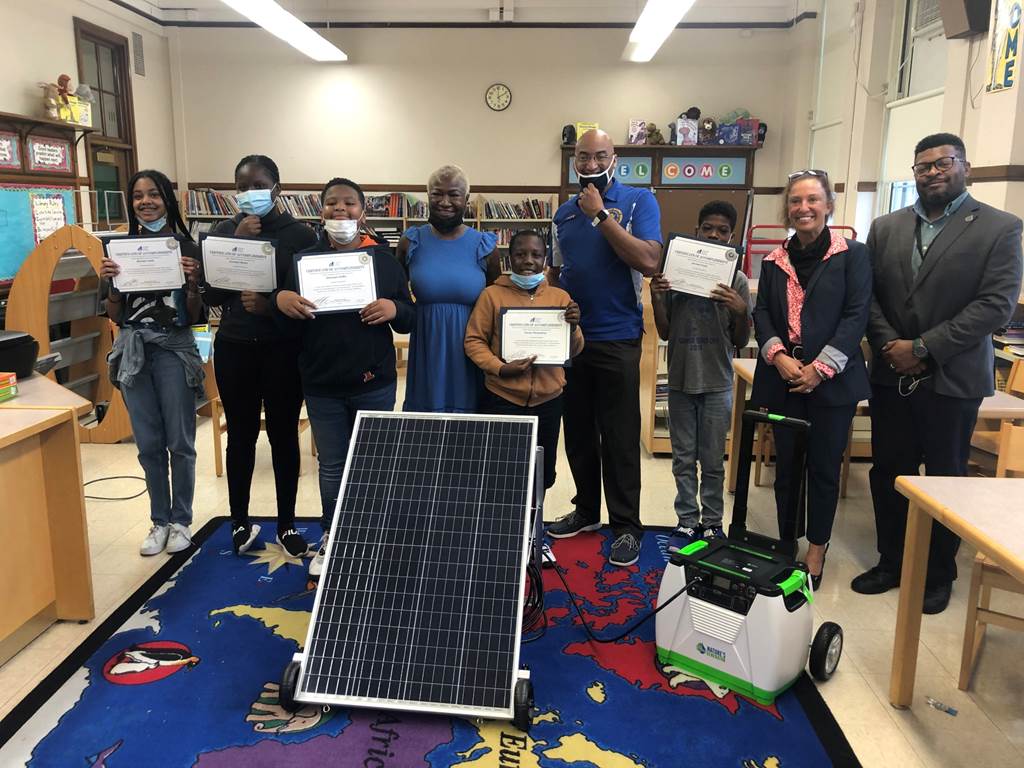 Students holding certificates