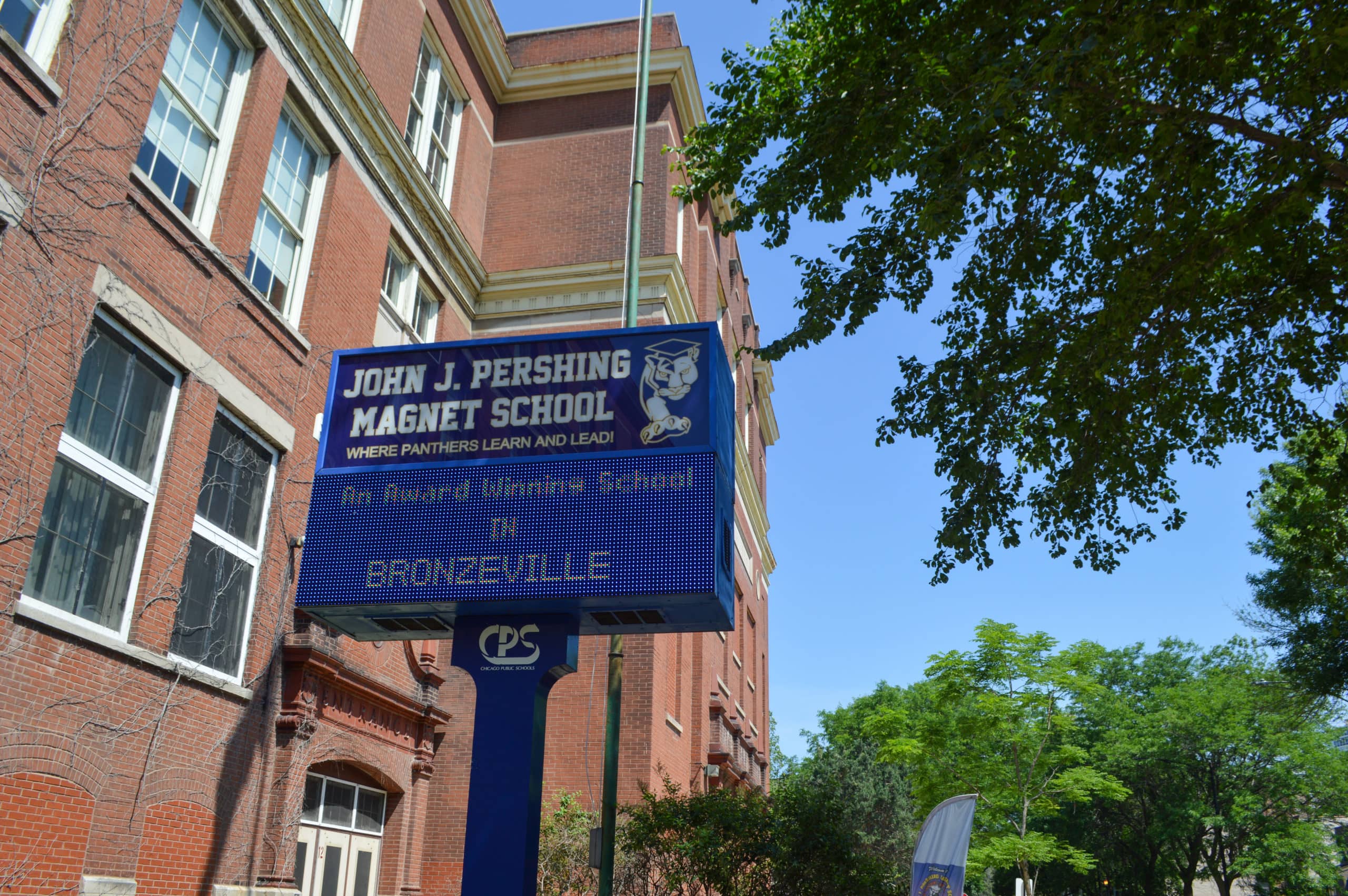 A sign that says John J Pershing Magnet School