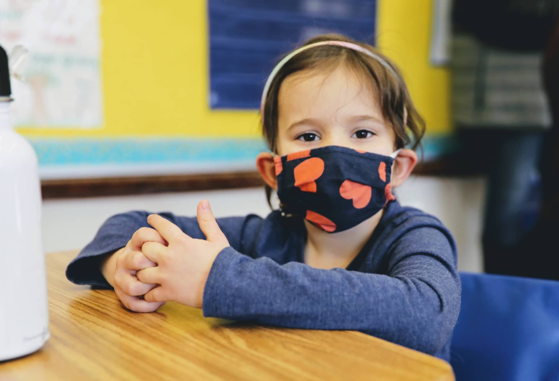 Student wearing a mask while sitting at a desk