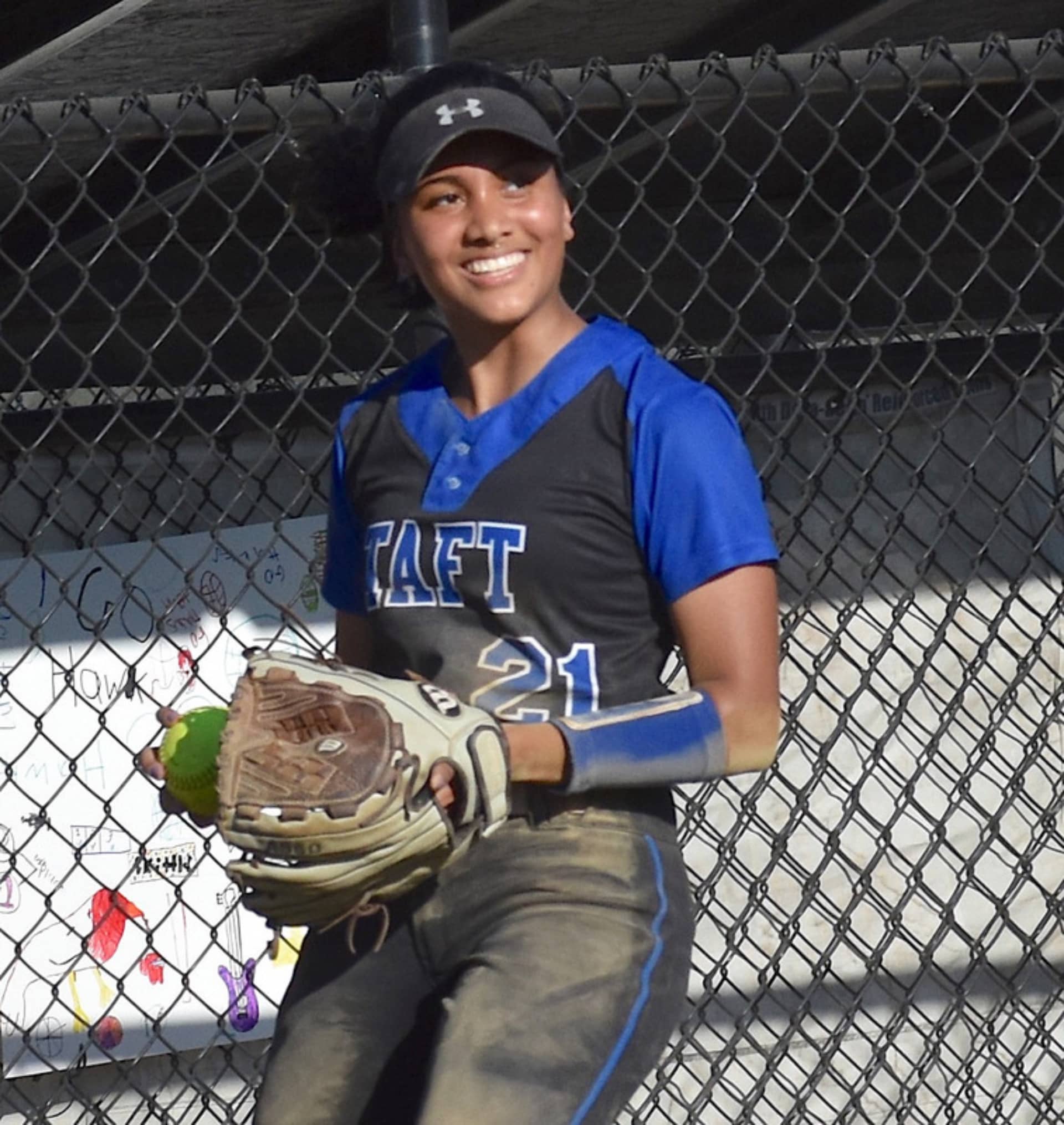 A girl holding a softball