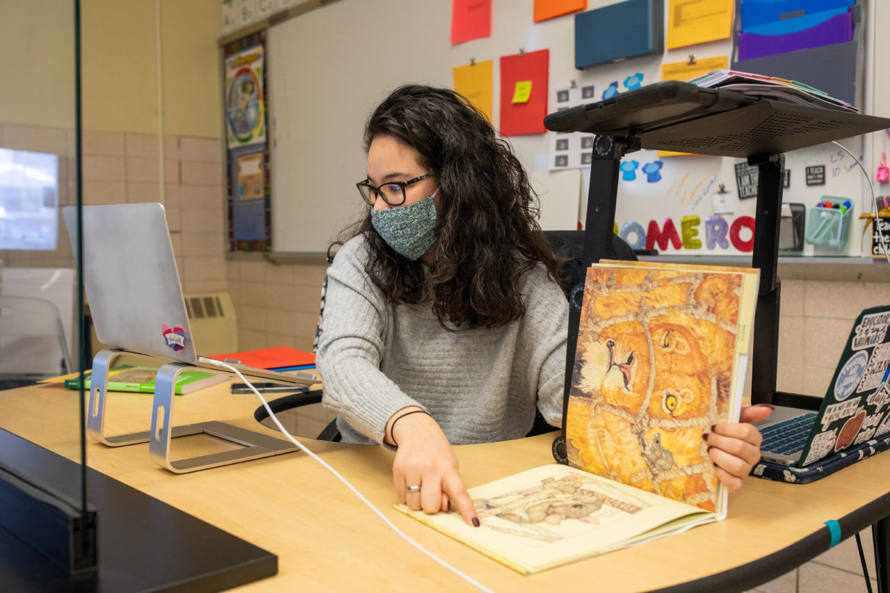 A teacher reading to the class